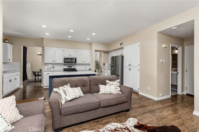 living area featuring recessed lighting, visible vents, baseboards, and dark wood-style flooring