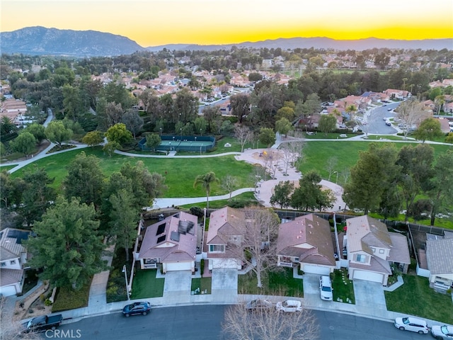 drone / aerial view with a residential view and a mountain view