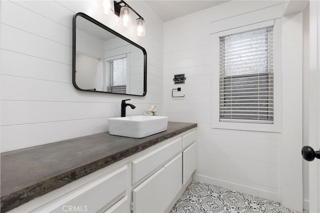 bathroom featuring tile patterned flooring and vanity