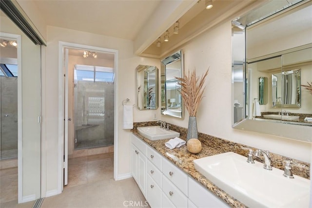 22364 Manacor Unit 9, Mission Viejo, CA 92692 - bathroom with a shower with door, double vanity, and tile patterned flooring