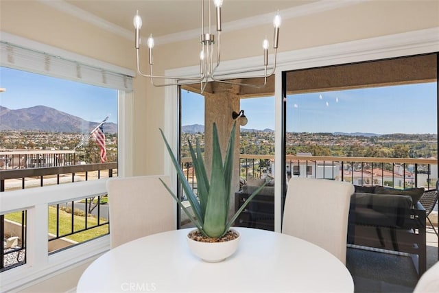22364 Manacor Unit 9, Mission Viejo, CA 92692 - dining area featuring a mountain view, crown molding, and a chandelier