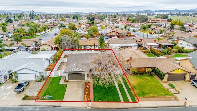 drone / aerial view with a mountain view and a residential view