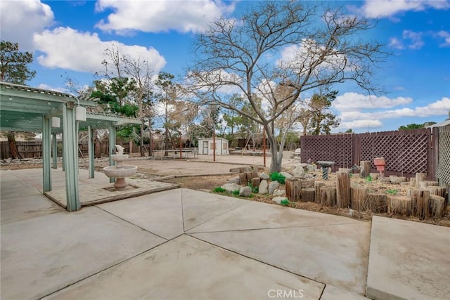 view of patio / terrace with a pergola and fence