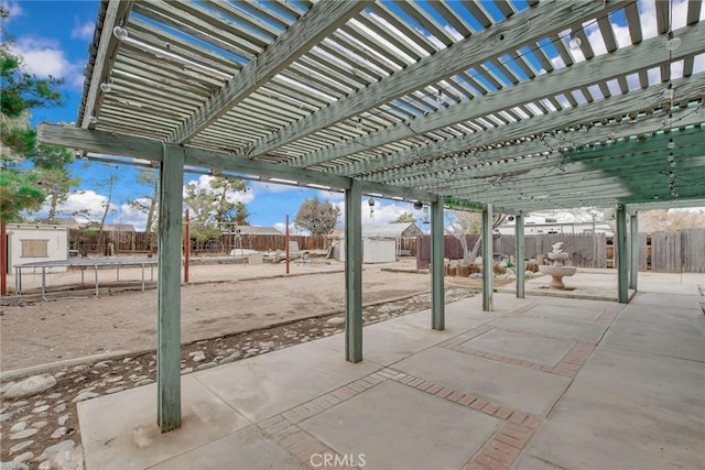 view of patio / terrace featuring a pergola and a fenced backyard