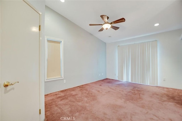 carpeted empty room featuring vaulted ceiling, recessed lighting, and ceiling fan