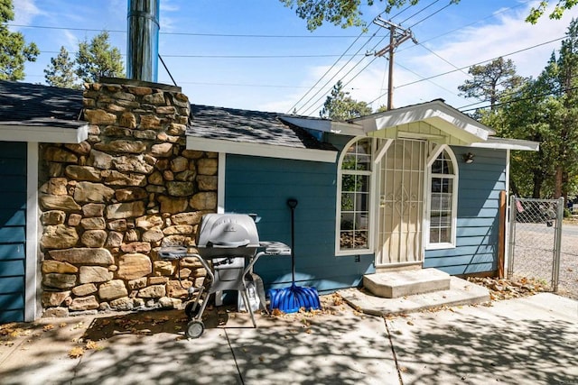 view of outdoor structure with a gate and fence