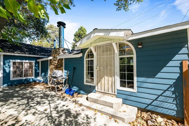 back of property featuring a patio area and entry steps