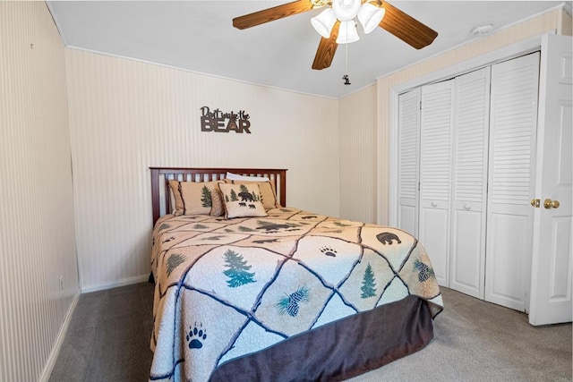 bedroom with a closet, light colored carpet, baseboards, and a ceiling fan