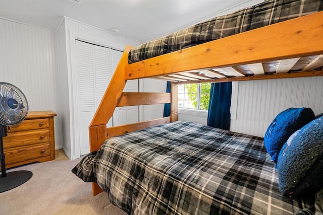 carpeted bedroom featuring a closet