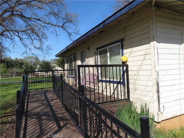 view of side of property featuring a deck