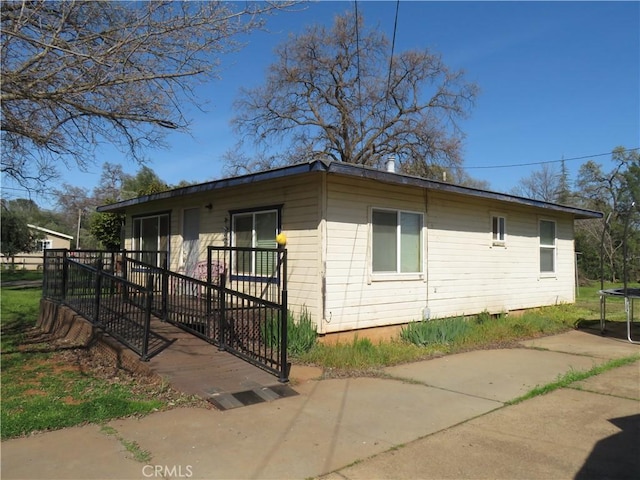 view of property exterior with a trampoline