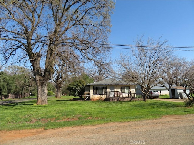 view of front facade with a carport and a front lawn