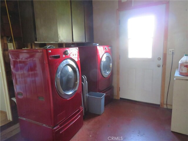 laundry area with cabinet space and washing machine and dryer