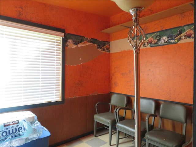 living area with tile patterned floors