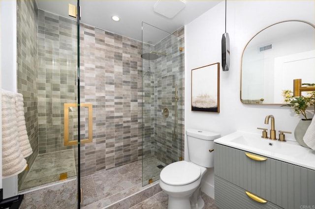 bathroom with visible vents, a stall shower, and toilet