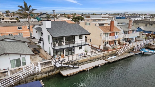 bird's eye view with a residential view and a water view