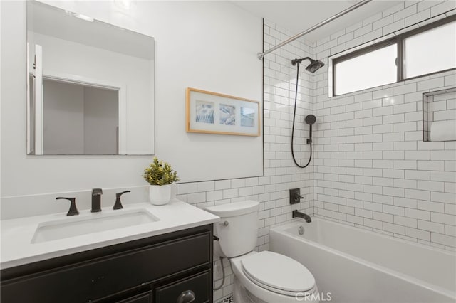 bathroom featuring vanity, toilet, and shower / bathtub combination