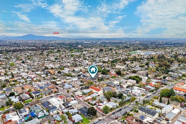 aerial view featuring a mountain view and a residential view