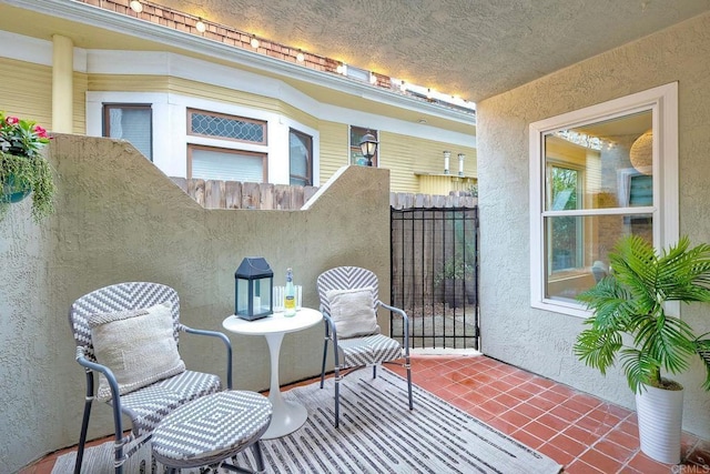 view of patio featuring fence