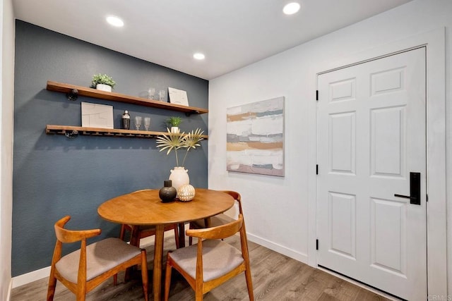 dining area with recessed lighting, baseboards, and light wood-type flooring