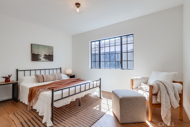 bedroom with wood finished floors