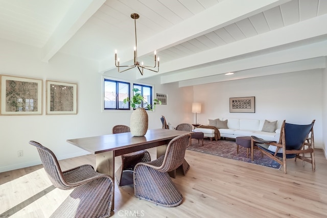 dining space featuring a notable chandelier, light wood-style flooring, baseboards, and beamed ceiling