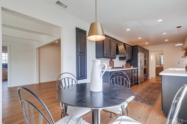 dining area with recessed lighting, visible vents, and light wood-style flooring