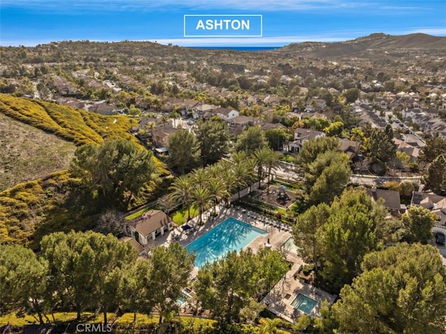 birds eye view of property with a mountain view