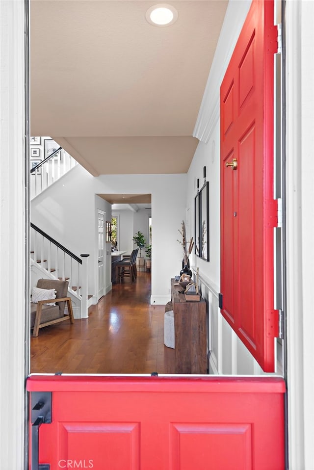 entrance foyer with wood finished floors and stairs