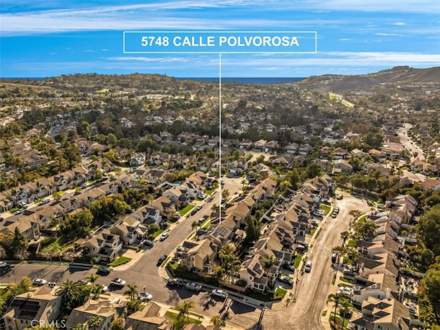 birds eye view of property featuring a mountain view and a residential view