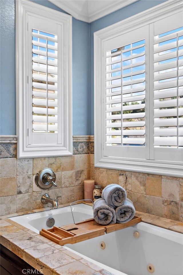 full bathroom featuring a whirlpool tub