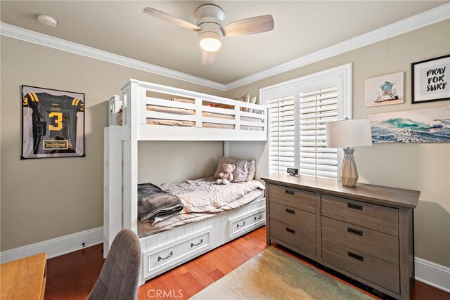 bedroom with baseboards, a ceiling fan, light wood-style floors, and ornamental molding