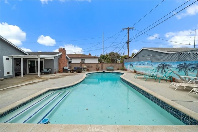 view of pool with a fenced in pool, a fenced backyard, and a patio area