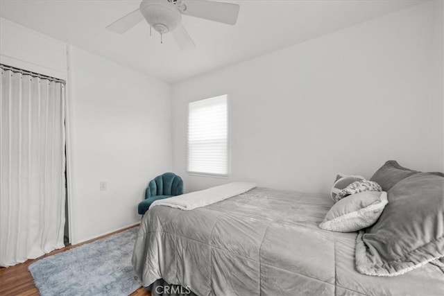 bedroom with ceiling fan and wood finished floors