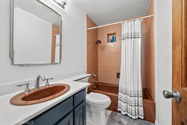 full bath featuring vanity, toilet, tile patterned flooring, and shower / tub combo with curtain