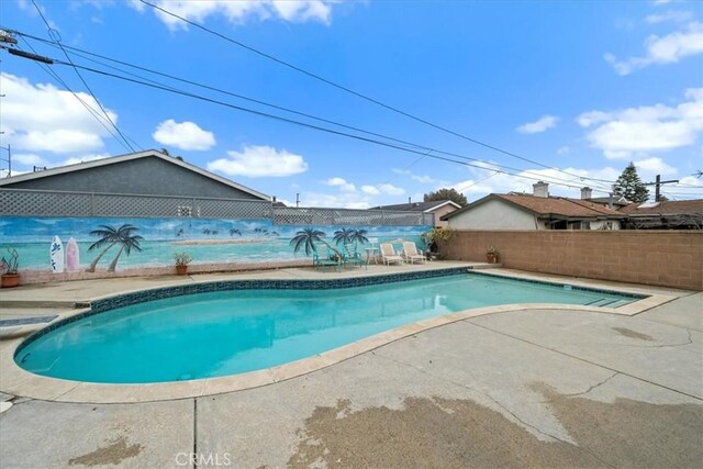 view of pool with a patio area, a fenced in pool, and a fenced backyard