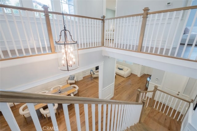 staircase with wood finished floors