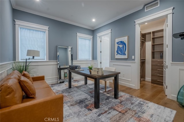 home office with recessed lighting, visible vents, wood finished floors, and crown molding