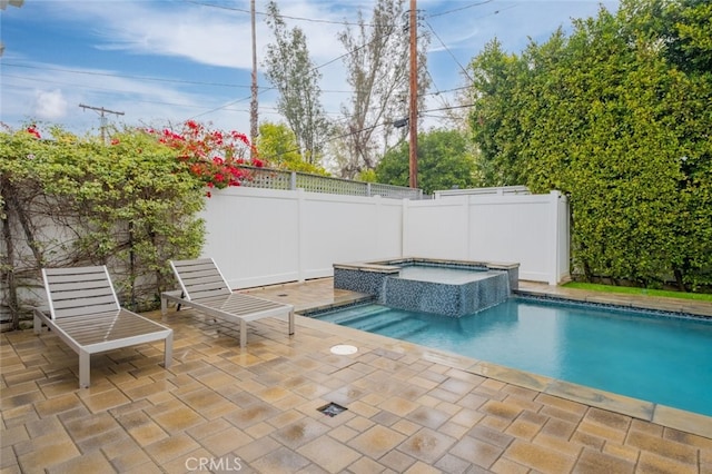 view of swimming pool featuring a fenced backyard, an in ground hot tub, a patio, and a fenced in pool