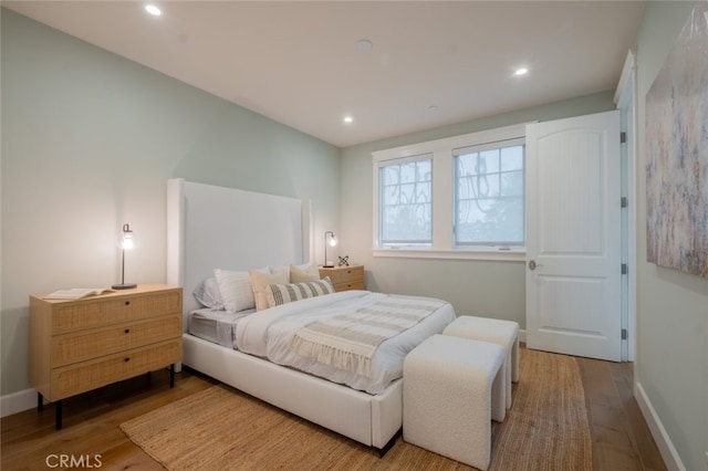 bedroom featuring recessed lighting, baseboards, and wood finished floors