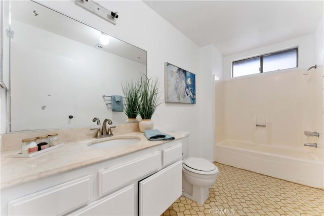 bathroom with vanity,  shower combination, and toilet