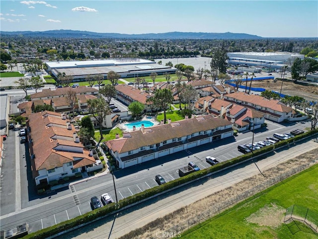 birds eye view of property with a mountain view