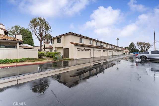 view of road with community garages