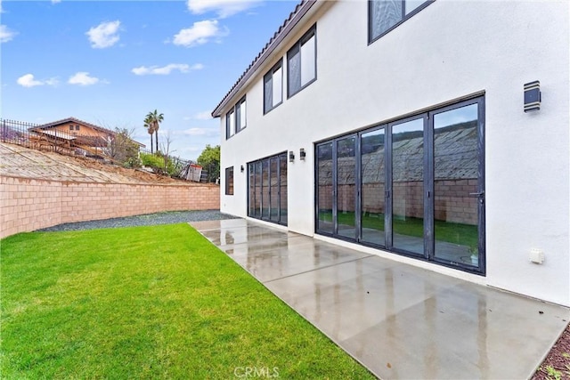 view of yard featuring a patio area and fence