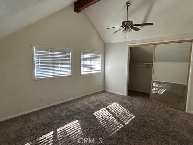 unfurnished bedroom featuring vaulted ceiling with beams, baseboards, carpet floors, a closet, and a ceiling fan