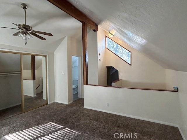 bonus room featuring carpet flooring, ceiling fan, lofted ceiling with beams, and baseboards