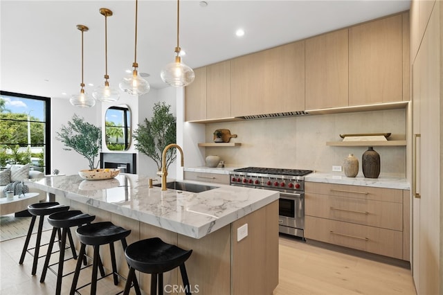 506 Avocado Ave, Corona Del Mar, CA 92625 - kitchen with light brown cabinets, open shelves, premium stove, decorative backsplash, and a sink