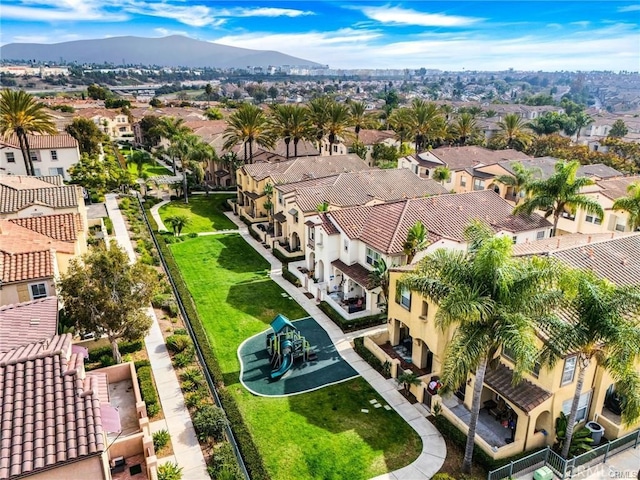 birds eye view of property featuring a mountain view and a residential view