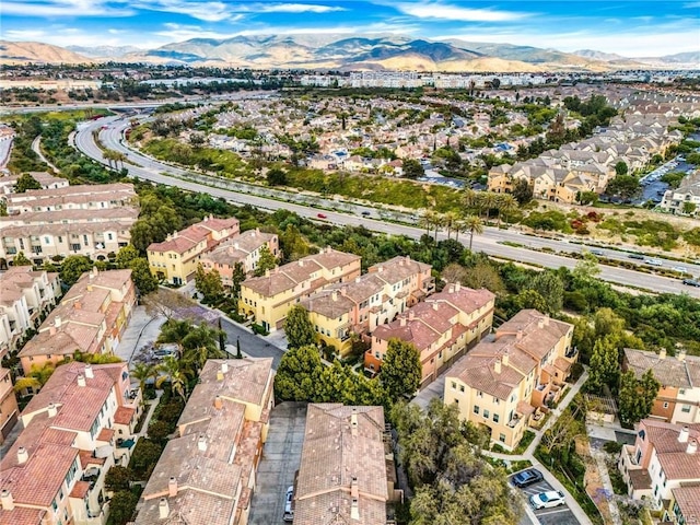 drone / aerial view featuring a residential view and a mountain view