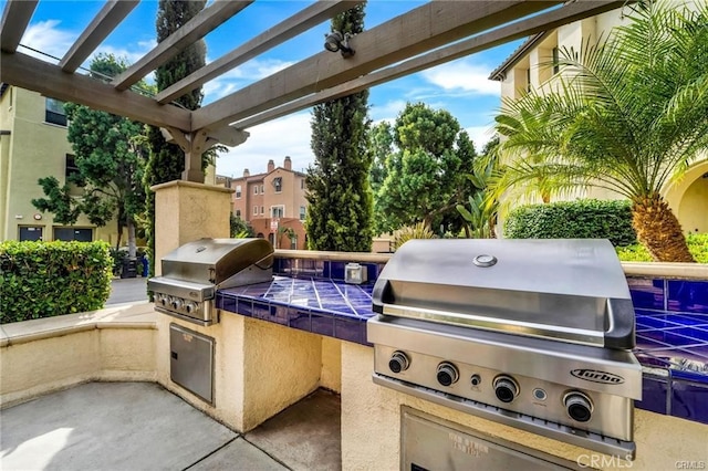 view of patio / terrace featuring area for grilling and an outdoor kitchen